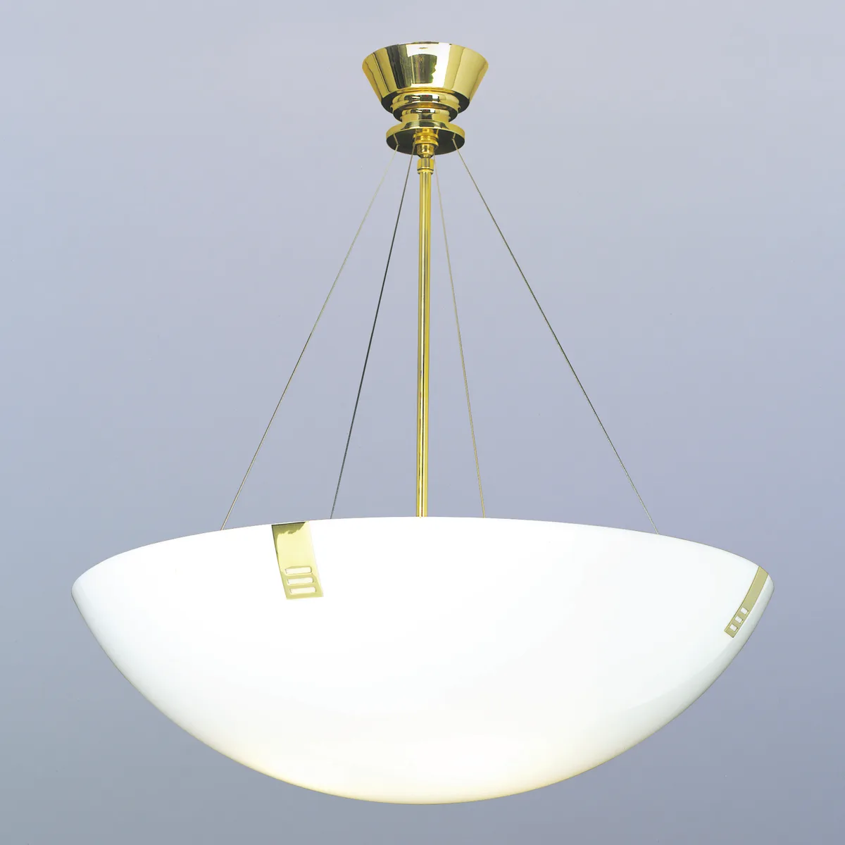 Bowl pendant on a plain backdrop: small canopy, centre stem and four thin cables holding a wide, shallow bowl with slotted clips at its rim, lit from within.