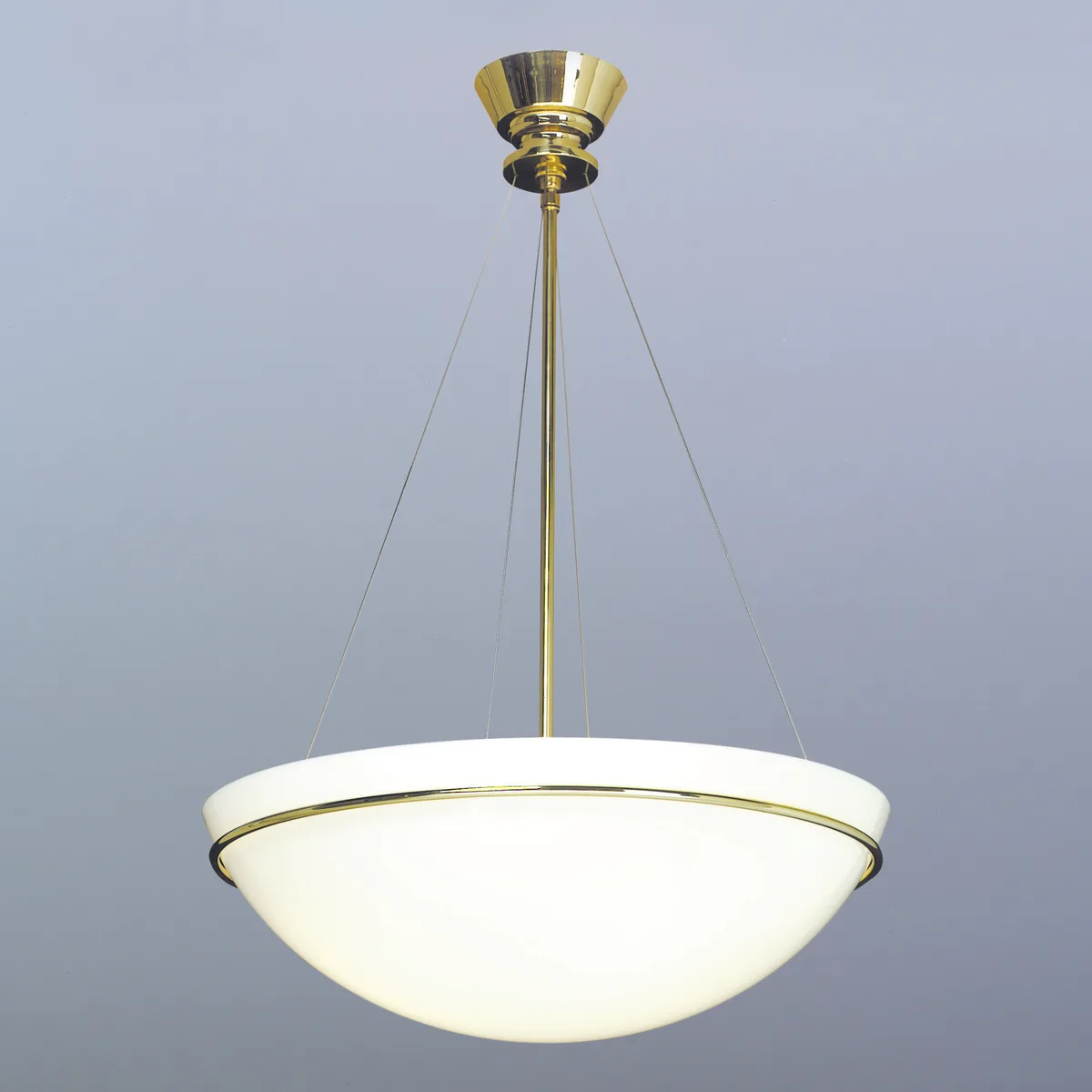 Bowl pendant on a plain backdrop: small canopy, centre stem and four thin cables holding a wide, shallow bowl with a narrow band at its rim, lit from within.
